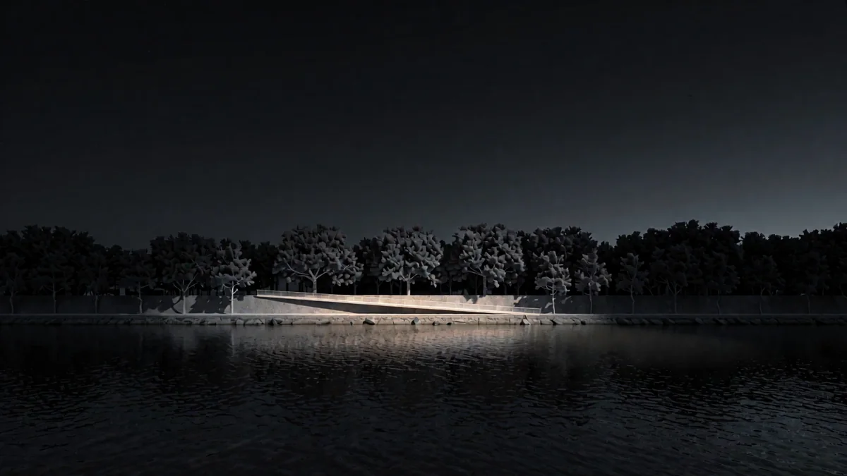 Una costanera de río con arboleda y una pasarela iluminada